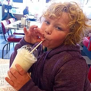 Everlynn is registered to the contest to win money with this photo: alcoholic_beverage, chair, cuisine, dish, drink, drinking, drinking_straw, drinkware, food, food_craving, frozen_dessert, gelato, hand, happy, ingredient, juice, non_alcoholic_beverage, person, soft_drink, tableware