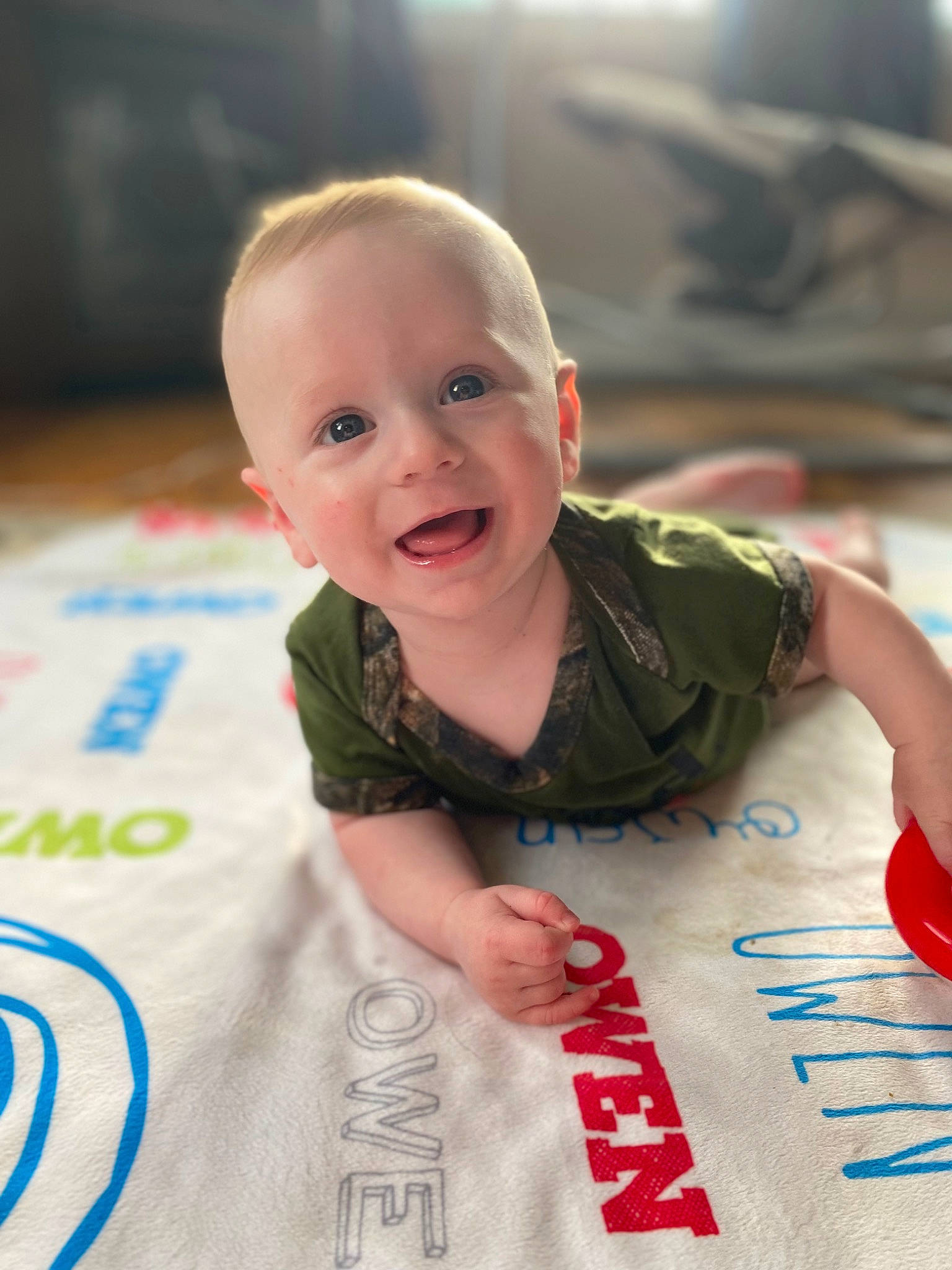 Owen joined the competition — help win amazing prizes! baby, baby_toddler_clothing, carmine, cheek, child, event, flooring, fun, happy, iris, leisure, mouth, pattern, person, sitting, skin, sleeve, smile, t_shirt, toddler