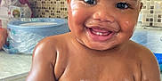 Kyrin is registered to the contest to win money with this photo: baby, child, bath, water, splashing, smiling, happy, indoor, mosaic_tiles, skin, face, wet, cute, infant, tub, playful, young_child, person, closeup, expression