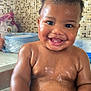 baby, child, bath, water, splashing, smiling, happy, indoor, mosaic_tiles, skin, face, wet, cute, infant, tub, playful, young_child, person, closeup, expression