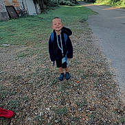 Rowen joined the competition — help win amazing prizes! child, boy, smiling, backpack, school, outdoor, rural, road, gravel, grass, trees, greenery, building, garage, outbuilding, summer, daylight, portrait, standing, shoes