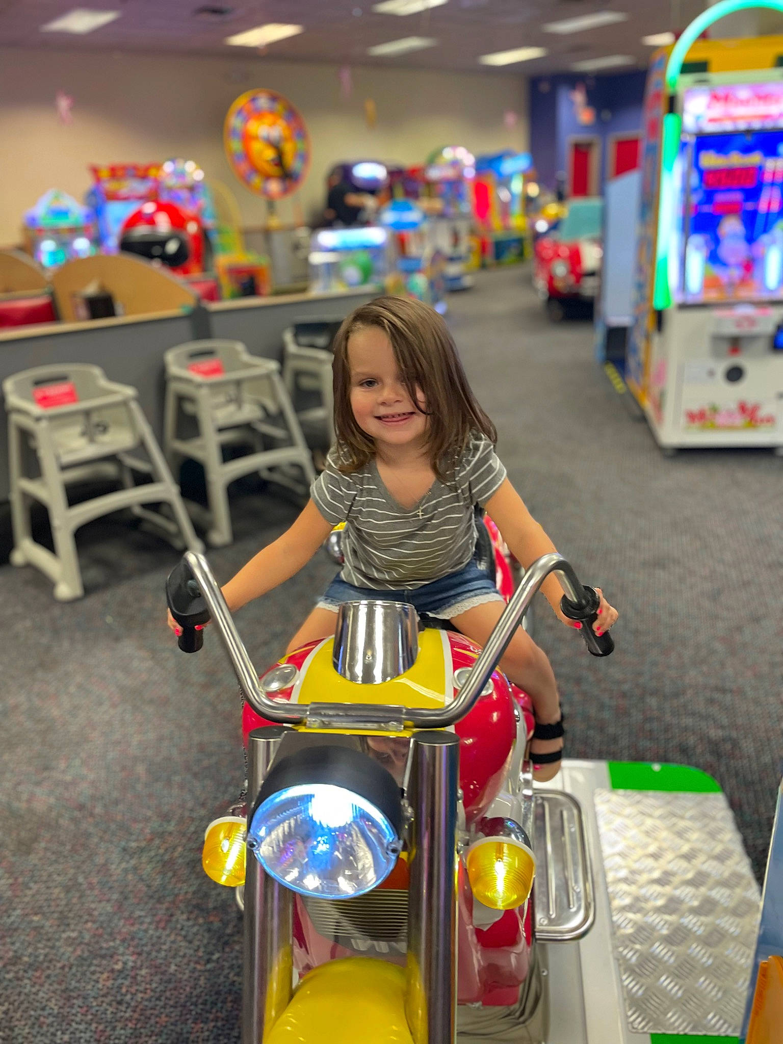 Scarlett-rose is registered to the contest to win money with this photo: automotive_design, automotive_lighting, automotive_tire, child, city, fun, joy, leisure, mode_of_transport, motor_vehicle, people, person, product, public_space, recreation, riding_toy, smile, tire, toddler, toy