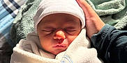 Asher joined the competition — help win amazing prizes! baby, bed, blanket, cozy, cute, fabric, hand, hat, headwear, indoor, infant, newborn, peaceful, person, portrait, rest, skin, sleeping, soft, wrapped