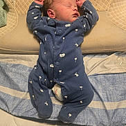 Asher is registered to the contest to win money with this photo: baby, bed, blanket, blue_clothing, child, cozy, cute, indoors, infant, newborn, onesie, palm_tree_pattern, peaceful, person, pillow, resting, sleep, sleeping, soft_lighting, van_pattern