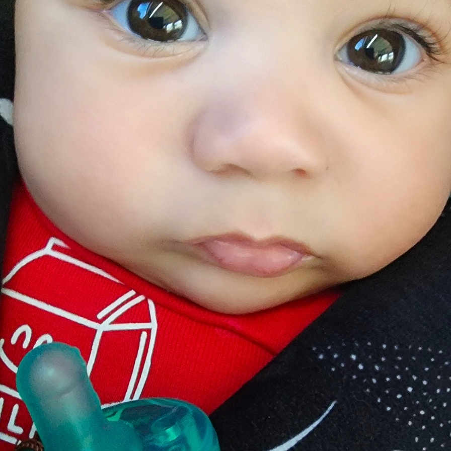 Kaidyn joined the competition — help win amazing prizes! baby, closeup, face, pacifier, red_clothing, infant, cute, child, expression, portrait, young, skin, eyes, mouth, nose, head, baby_toy, adorable, childhood, innocence