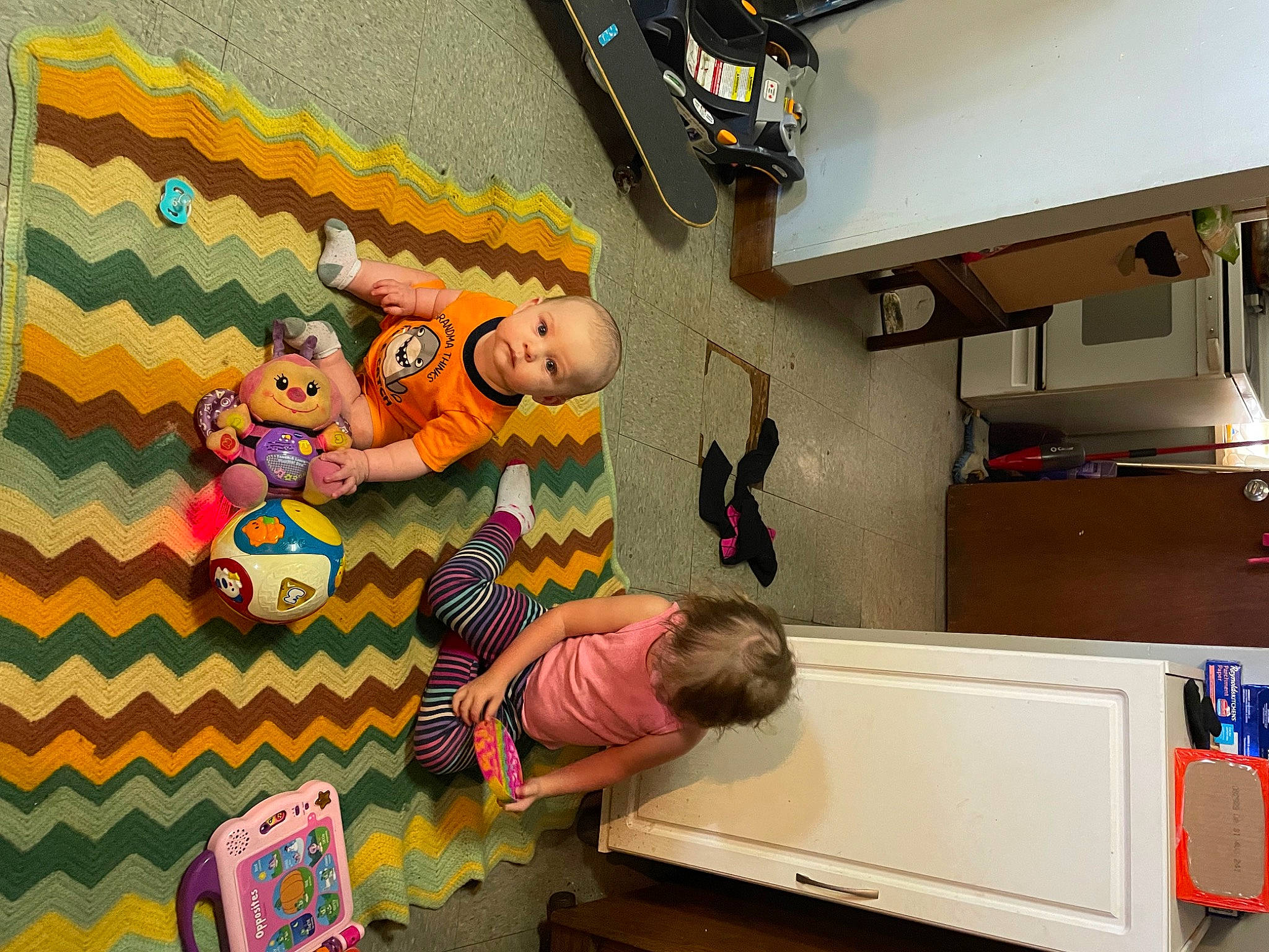 Drayden is registered to the contest to win money with this photo: art, baby, baby_products, baby_toddler_clothing, baby_toys, ceiling, child, flooring, fun, interior_design, leisure, pattern, person, play, room, t_shirt, tire, toddler, visual_arts, yellow