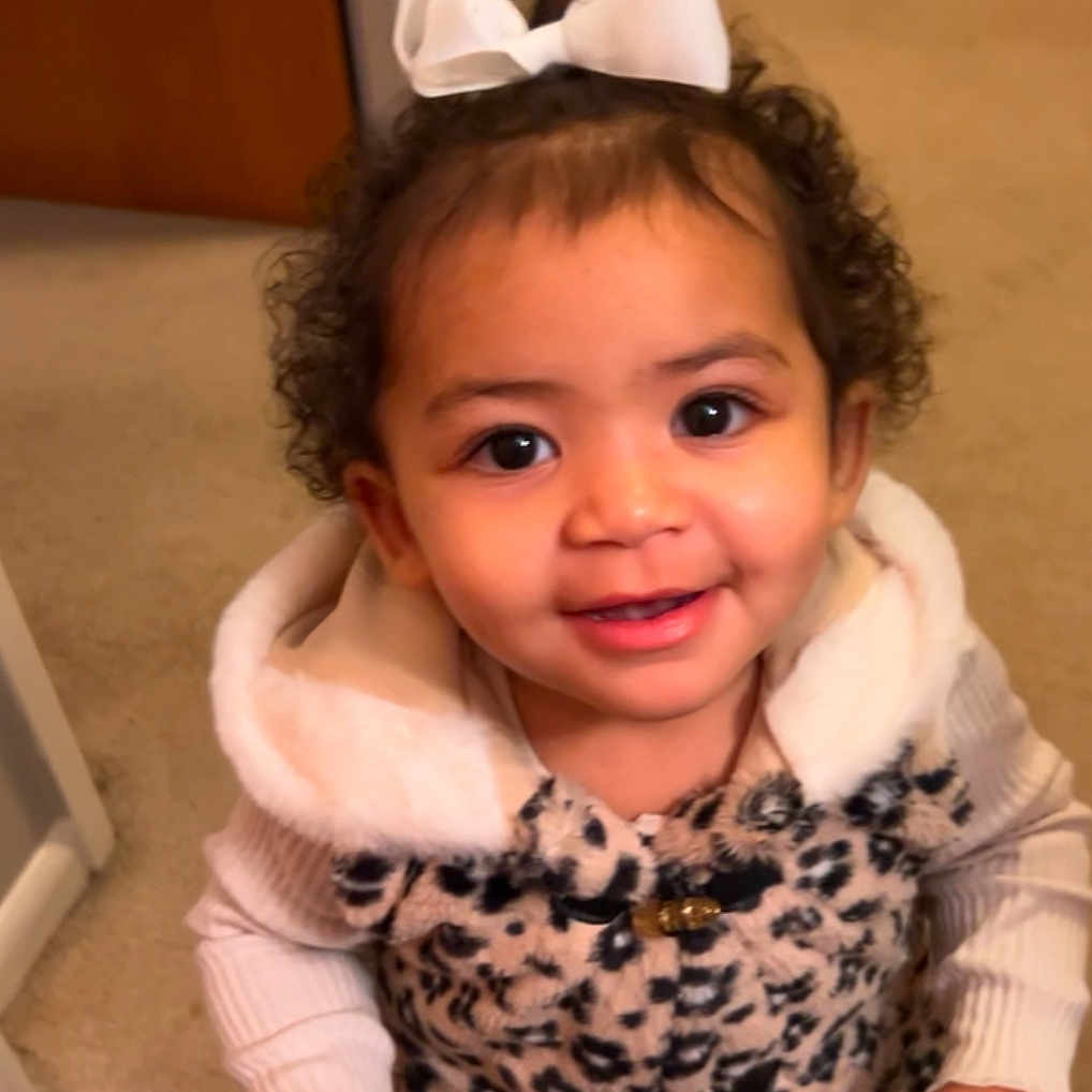 Amiri joined the competition — help win amazing prizes! baby, babylaughing, bodypart, clothing, coat, door, dress, face, finger, hand, happy, head, laughing, mouth, person, photography, portrait, smile, teeth, wood