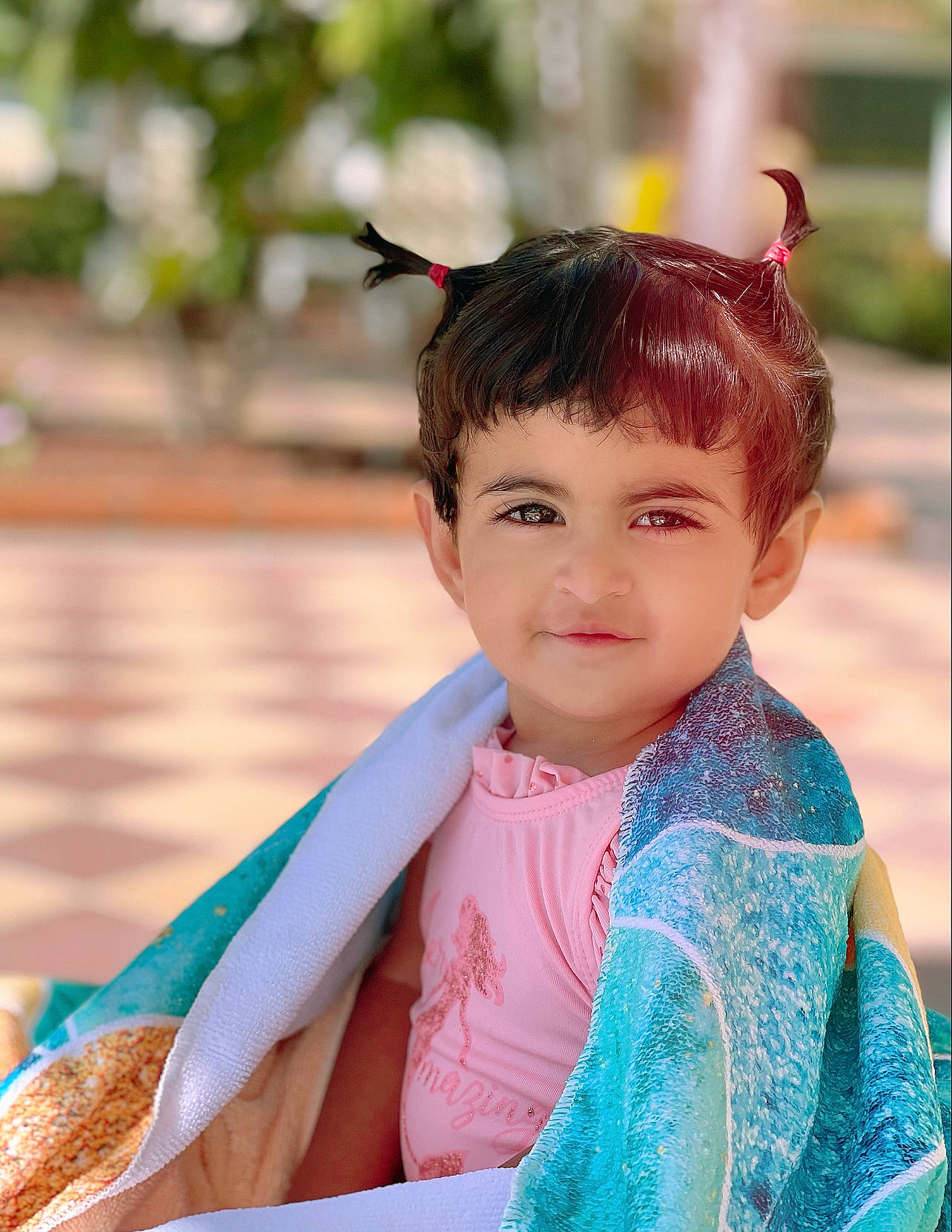 Jacey is registered to the contest to win money with this photo: bangs, child, electric_blue, face, fun, hair, happy, head, leisure, magenta, person, portrait_photography, recreation, sitting, sleeve, smile, street_fashion, temple, toddler, tradition