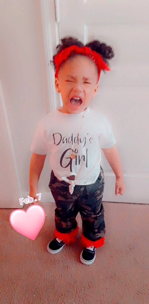 Jada is registered to the contest to win money with this photo: baby_toddler_clothing, balloon, child, face, facial_expression, fun, hairstyle, happy, head, neck, orange, organ, party_supply, person, pink, red, sleeve, smile, sportswear, t_shirt