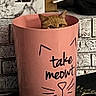 brick_wall, cat, cat_face, container, cute, eyes, funny, gallery_ui, ginger_cat, home_decor, indoor, motion_photo, mug, peeking, pet, pink_container, screenshot, sneaky, still_life, whiskers