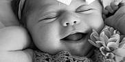 Paisley joined the competition — help win amazing prizes! baby, infant, smiling, black_and_white, headband, bow, crochet, flower, closeup, cute, peaceful, sleepy, portrait, child, happy, soft, texture, handmade, clothing, adorable