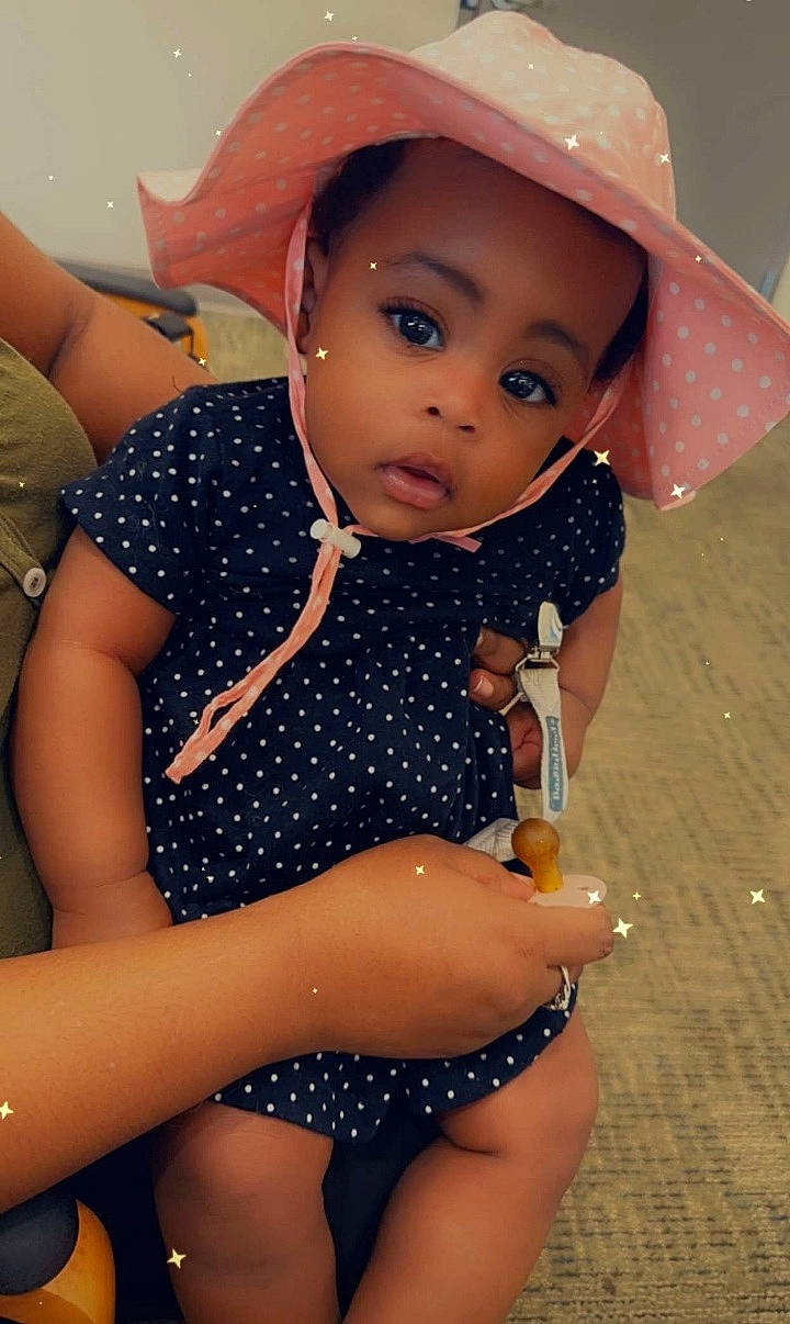 Scarlett is registered to the contest to win money with this photo: baby_toddler_clothing, beauty, black_hair, cap, eye, finger, fun, hairstyle, happy, hat, lip, neck, organ, person, photograph, skin, summer, sun_hat, thigh, toddler