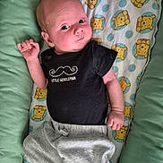 Thomas joined the competition — help win amazing prizes! baby, infant, child, black_shirt, little_gentleman, winnie_the_pooh, blanket, gray_pants, lying_down, cute, curious, indoors, soft_toys_pattern, newborn, small_hands, casual_clothing, comfort, portrait, expression, resting
