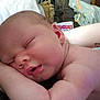 Thomas is registered to the contest to win money with this photo: baby, newborn, sleeping, closeup, skin, arm, blanket, tattoo, indoors, cozy, face, peaceful, infant, resting, human, person, soft, couch, home, comfort