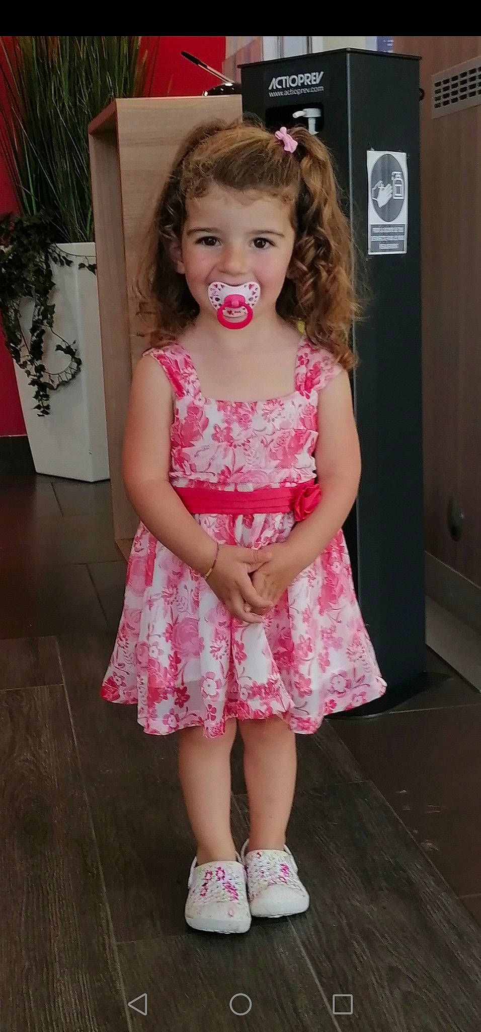 Krystal participe au concours pour gagner de l'argent avec cette photo : baby_toddler_clothing, cheek, day_dress, dress, embellishment, eyelash, fashion_design, gesture, happy, iris, joy, lip, long_hair, neck, one_piece_garment, person, pink, plant, skin, sleeve