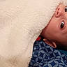 baby, infant, child, portrait, lying_down, blanket, white_blanket, blue_background, wide_eyes, face, eyes, nose, ear, head, bed, cozy, indoors, close_up, photography, cute