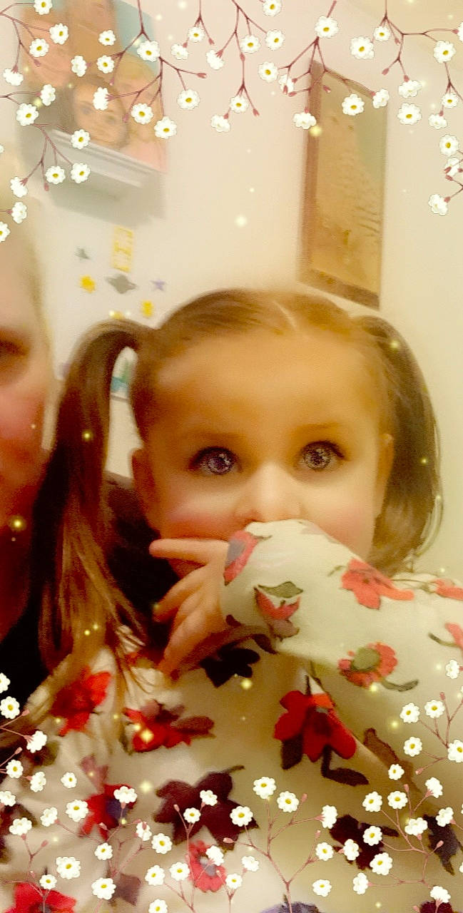 Noelle joined the competition — help win amazing prizes! cheek, child, chin, christmas, christmas_decoration, christmas_ornament, event, eye, eyebrow, eyelash, facial_expression, hair, hand, happy, iris, lip, long_hair, ornament, person, plant