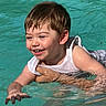 John joined the competition — help win amazing prizes! adult_hand, child, closeup, face, fun, happy, joy, outdoor, person, play, pool, skin, sleeveless_shirt, smiling, summer, swimming, toddler, water, wet_hair, young