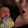 Buckley joined the competition — help win amazing prizes! animal_print, baby, blanket, casual, child, comfort, couch, cozy, expression, face, head, holding, home, indoor, pajamas, person, pillow, portrait, skin, woman