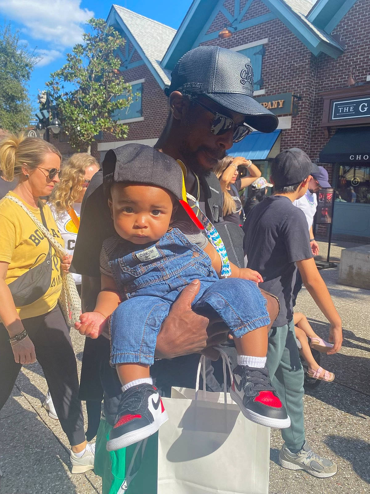 Myles joined the competition — help win amazing prizes! accessories, adult, architecture, bag, baseballcap, building, cap, clothing, face, female, footwear, handbag, hat, outdoors, pants, people, person, shelter, shoe, woman