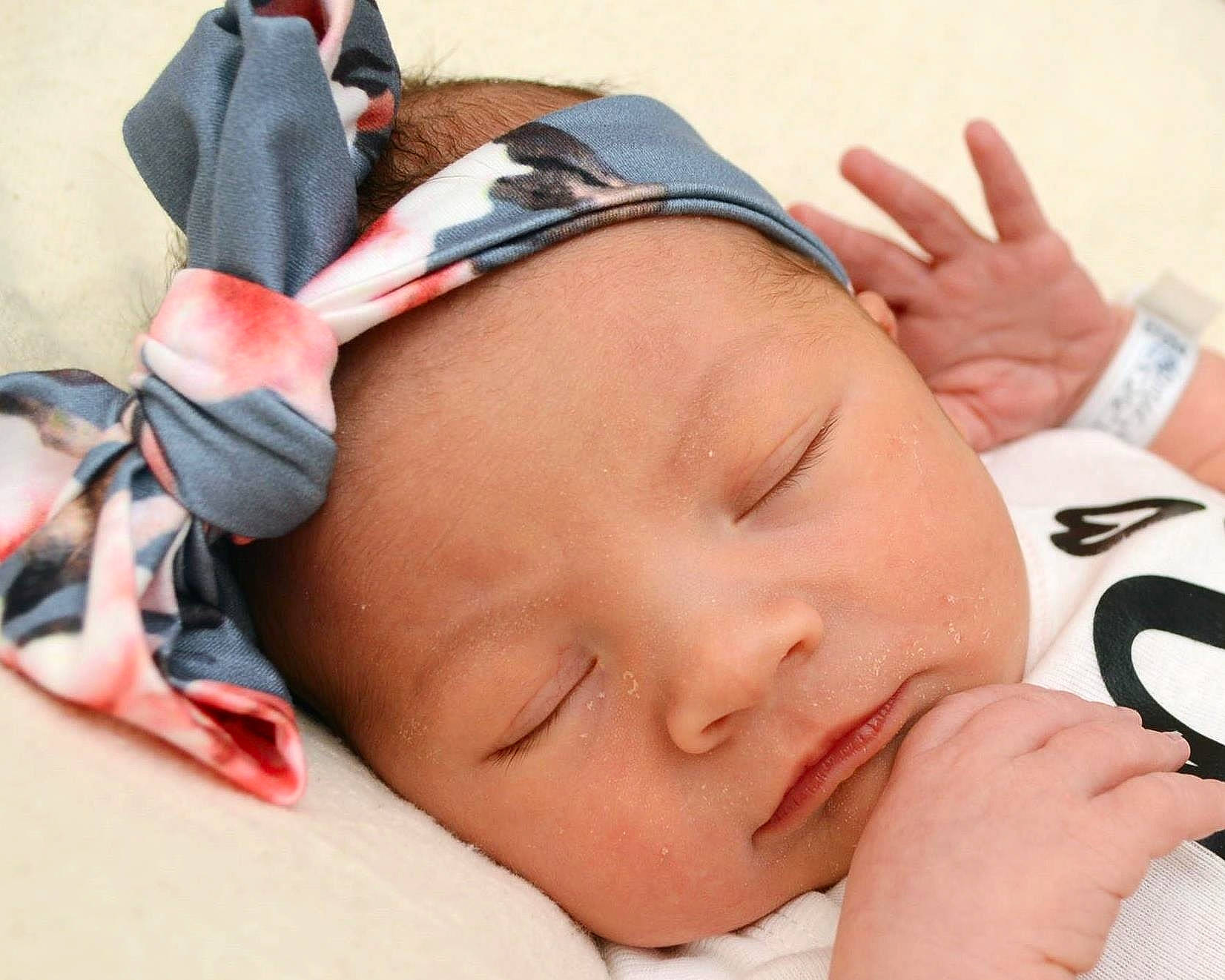 Minnie is registered to the contest to win money with this photo: baby, baby_sleeping, birth, cheek, child, ear, eye, face, finger, forehead, gesture, hand, head, mouth, nap, neck, nose, person, skin, sleep