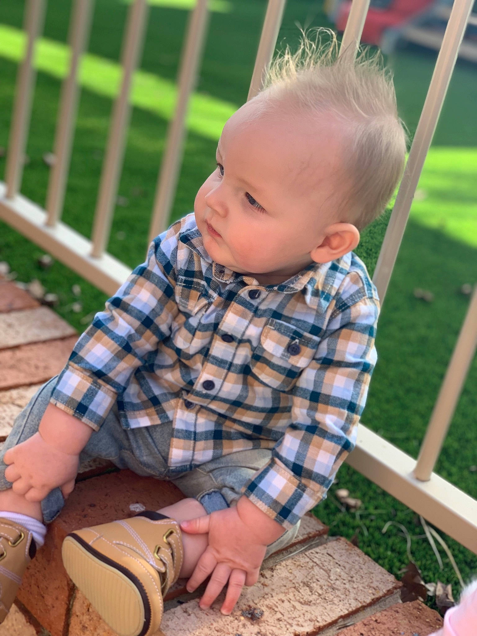 Kruz is registered to the contest to win money with this photo: baby, blond, child, design, garden, grass, leisure, outdoor_play_equipment, pattern, person, plaid, play, playground, sitting, skin, smile, summer, toddler, vacation, yard