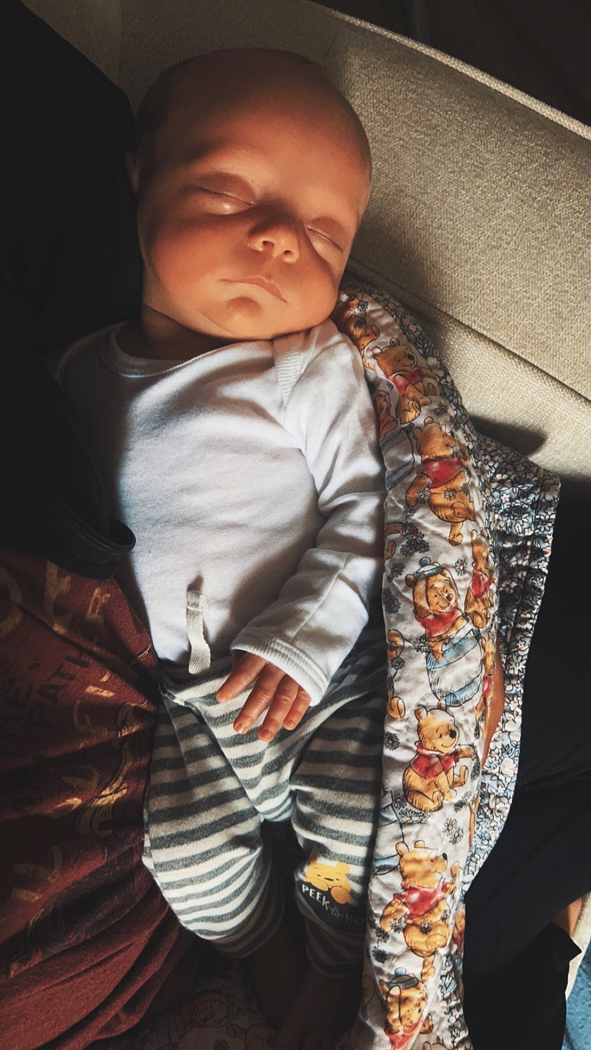 Estella is registered to the contest to win money with this photo: arm, baby, baby_products, baby_toddler_clothing, child, collar, comfort, finger, flash_photography, fur, happy, linens, outerwear, pattern, person, plaid, sitting, sleeve, tartan, toddler