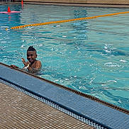 Josh joined the competition — help win amazing prizes! child, swimming_pool, water, happy, smiling, waving, tile_floor, lane_divider, indoor_pool, swimmer, fun, blue_water, splash, person, swimwear, hair_style, recreation, leisure, active, youth