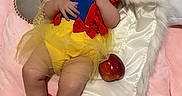 Lisa joined the competition — help win amazing prizes! apple, baby, child, costume, curly_hair, cute, fur_blanket, indoor, infant, mirror, pink_blanket, playful, portrait, red_bow, red_socks, six_months, smiling, snow_white_costume, soft_lighting, yellow_tutu