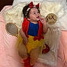 Lisa joined the competition — help win amazing prizes! baby, infant, child, smiling, costume, snow_white, headband, red_bow, yellow_skirt, blue_top, red_shoes, blanket, fur_blanket, mirror, milestone, six_months, red_apple, indoors, portrait, happy