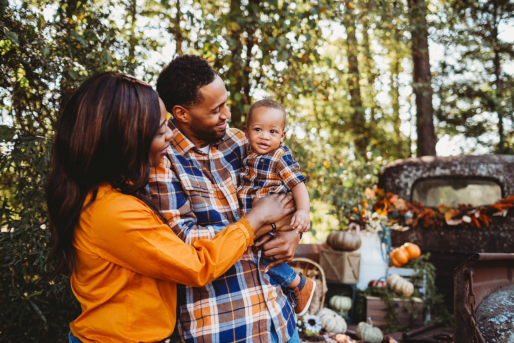 Ayaan is registered to the contest to win money with this photo: event, family, happy, interaction, joy, love, people, person, photograph, photography, picnic, plaid, plant, recreation, sitting, tartan, tree