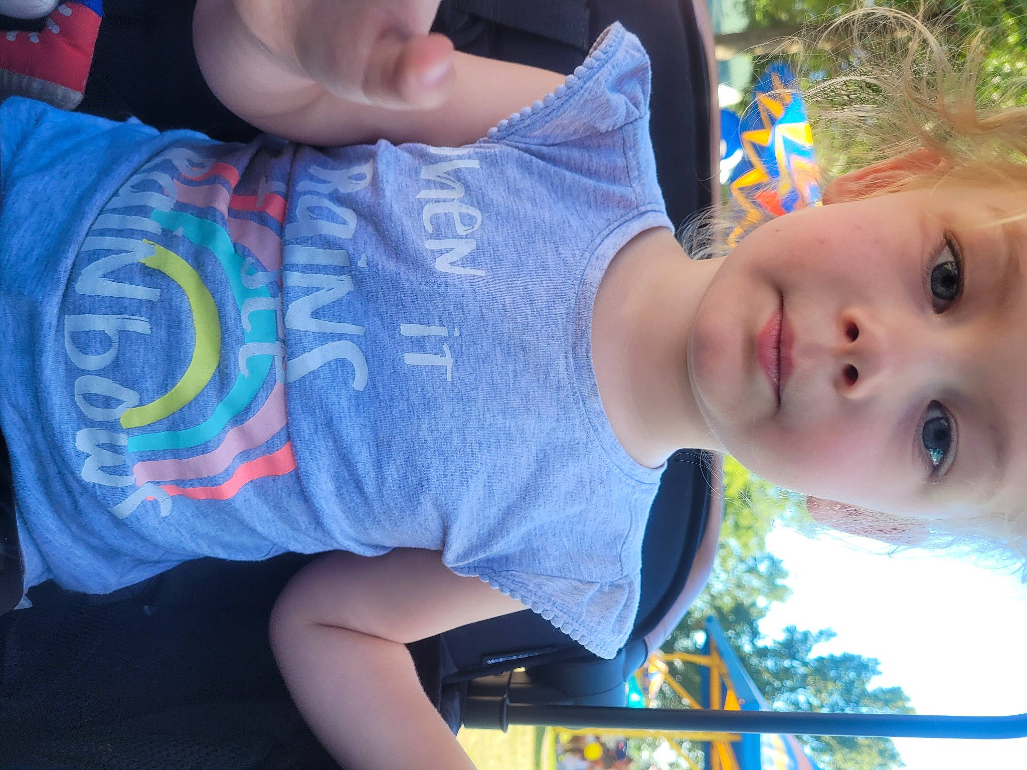 Adalynn is registered to the contest to win money with this photo: arm, child, cool, elbow, finger, fun, grass, happy, headwear, joint, leisure, mouth, organ, person, plant, shoulder, sleeve, summer, t_shirt, toddler