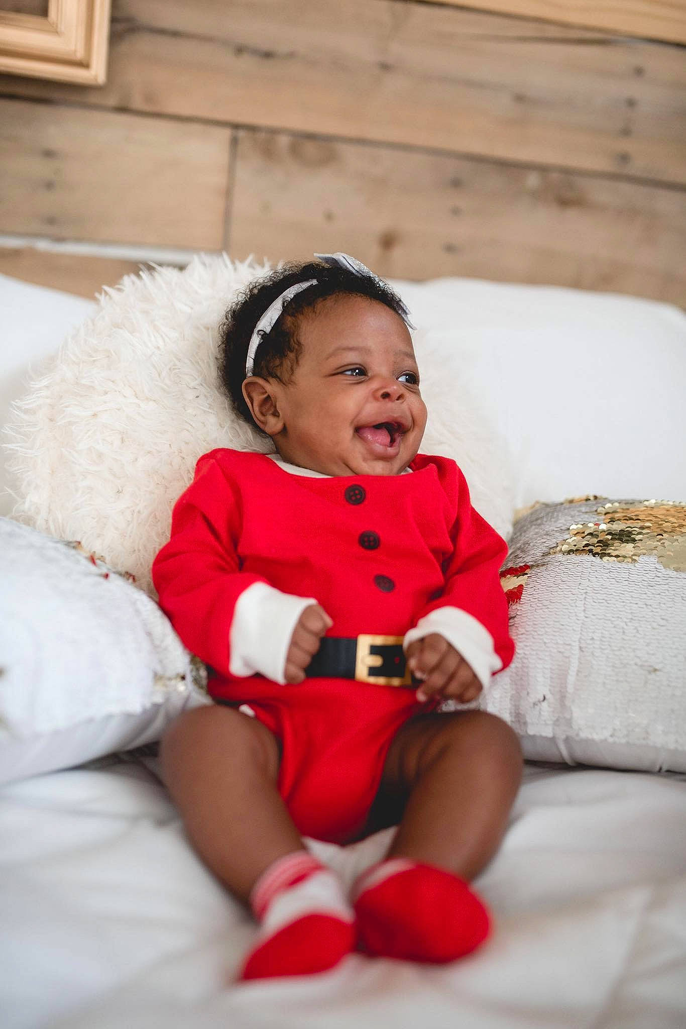 Dana is registered to the contest to win money with this photo: child, fun, girl, hair_accessory, happiness, infant, person, product, red, sitting, skin, smile, toddler