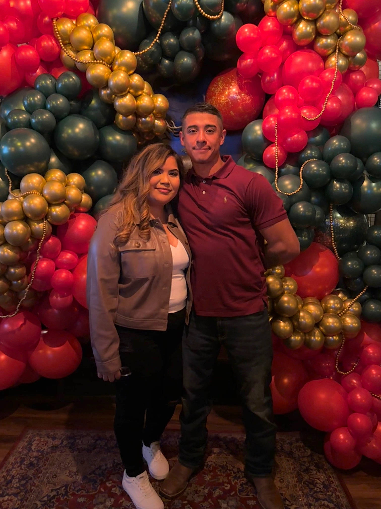 Andy is registered to the contest to win money with this photo: balloon, clothing, event, formal_wear, fun, happy, jeans, joy, local_food, natural_foods, orange, party, party_supply, person, photograph, photography, plant, red, seedless_fruit, smile