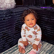 Liyah Maldonado is registered to the contest to win money with this photo: baby, carpet, child, couch, cozy, curly_hair, cushion, fuzzy_pillow, happy, home, indoor, infant, living_room, pajamas, pink_socks, portrait, sitting, smiling, sofa, teddy_bears