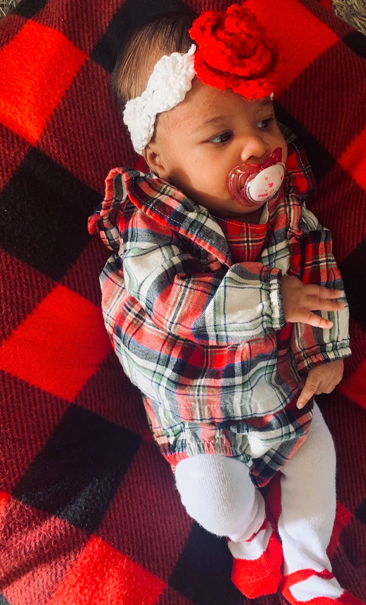 Anyla joined the competition — help win amazing prizes! baby, baby_toddler_clothing, comfort, eye, face, facial_expression, head, headwear, human_body, lip, mouth, orange, outerwear, person, pink, plaid, red, skin, sleeve, tartan