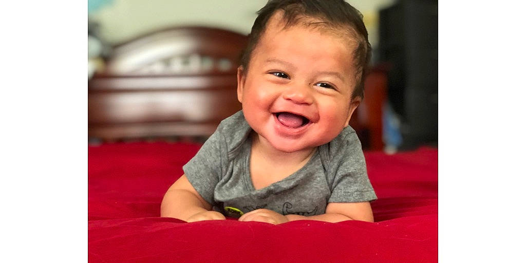 Leroy is registered to the contest to win money with this photo: baby, baby_laughing, baby_making_funny_faces, cheek, child, chin, face, facial_expression, happy, head, joy, laugh, mouth, nose, person, skin, smile, toddler, tummy_time