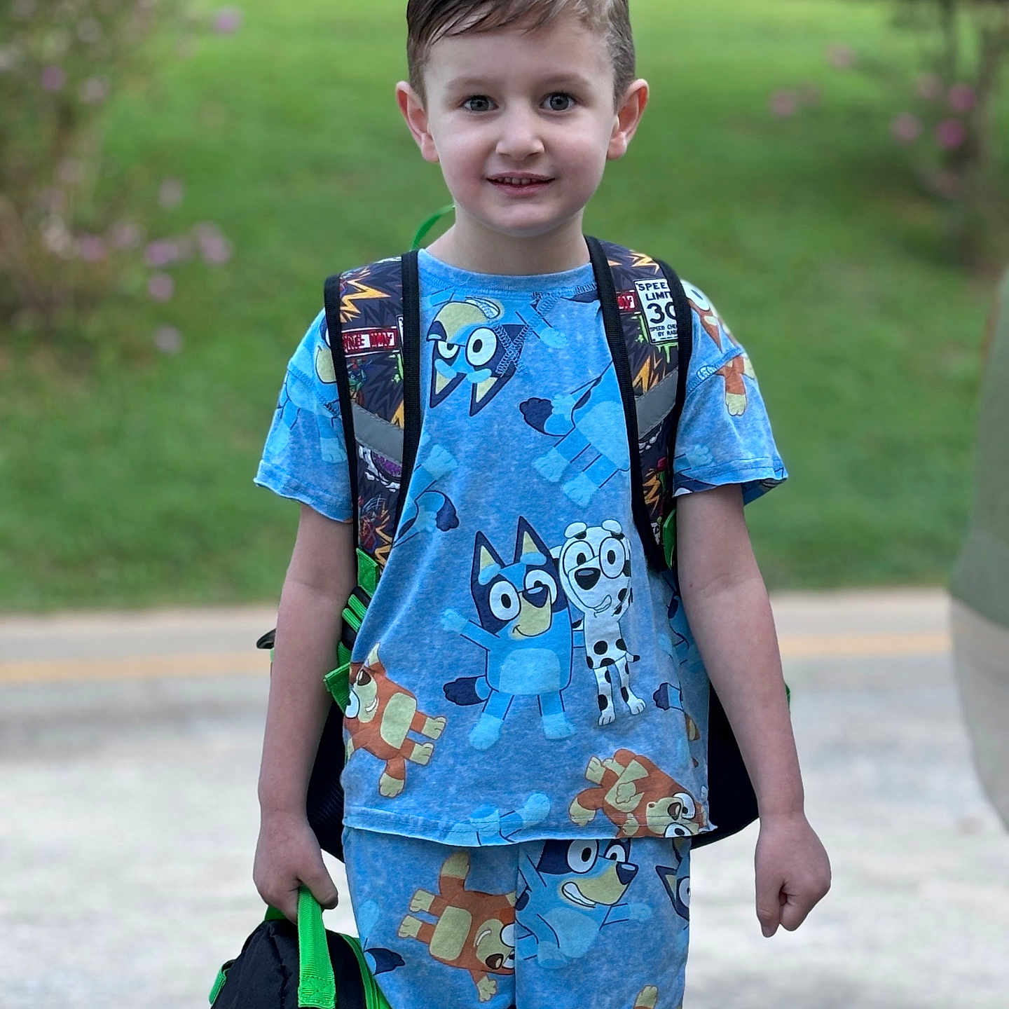 Bennett joined the competition — help win amazing prizes! backpack, bag, boy, child, clothing, dress, face, grass, head, herbal, male, pants, person, photography, plant, portrait, shorts, standing, t_shirt, walking
