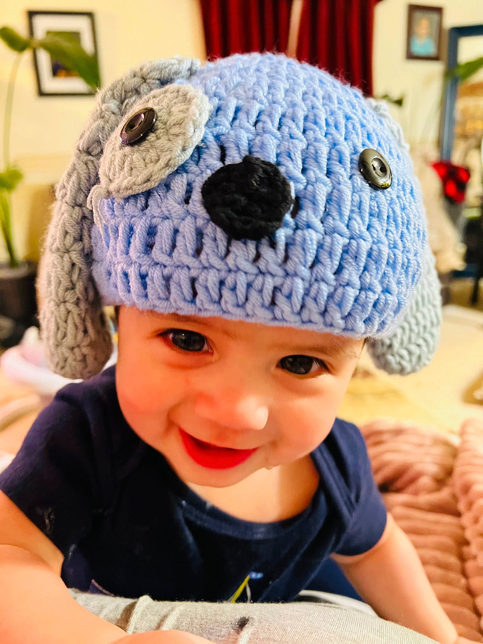 Apollo is registered to the contest to win money with this photo: baby, baby_toddler_clothing, cap, child, electric_blue, face, facial_expression, fun, happy, hat, headgear, headwear, joy, knit_cap, outerwear, pattern, person, sleeve, smile, textile