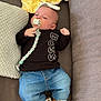 Khyronn a rejoint le concours — aidez-le/la à gagner de superbes lots ! baby, infant, pacifier, clothing, jeans, shoes, plush_toy, pillow, couch, black_shirt, blue_jeans, brown_shoes, cute, indoors, lying_down, child, person, comfortable, home, casual