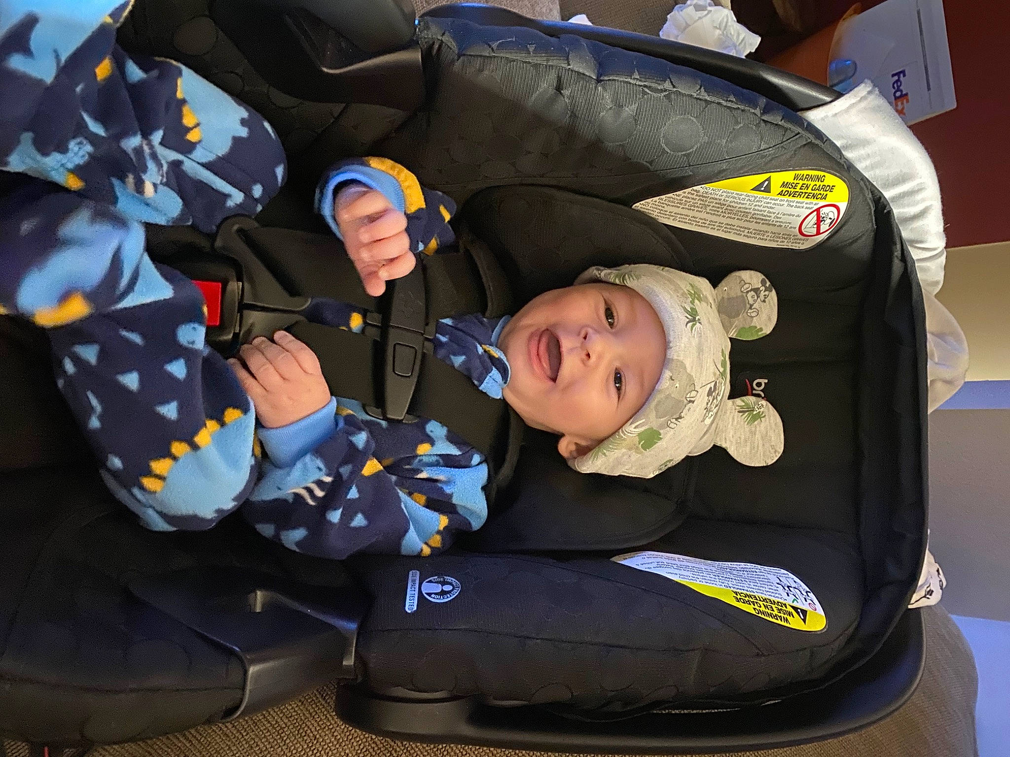 Everitt is registered to the contest to win money with this photo: auto_part, baby, baby_carriage, baby_in_car_seat, baby_products, baby_toddler_clothing, car_seat, child, comfort, headwear, motor_vehicle, person, personal_protective_equipment, sitting, sleeve, suit, toddler, transport, uniform, vehicle