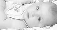 Grace is registered to the contest to win money with this photo: baby, black_and_white, blanket, child, close_up, cute, expression, eyes, face, head, infant, lying_down, monochrome, pattern, peaceful, portrait, skin, soft, tender, young