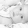 Grace is registered to the contest to win money with this photo: baby, infant, face, eyes, blanket, pattern, close_up, portrait, soft, cute, child, lying_down, expression, monochrome, black_and_white, peaceful, tender, skin, head, young