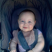 Grace joined the competition — help win amazing prizes! arm, baby, bib, blue_eyes, child, childcare, closeup, cute, face, hand, happy, head, infant, padded_stroller, pink_clothing, portrait, seatbelt, sitting, smile, stroller