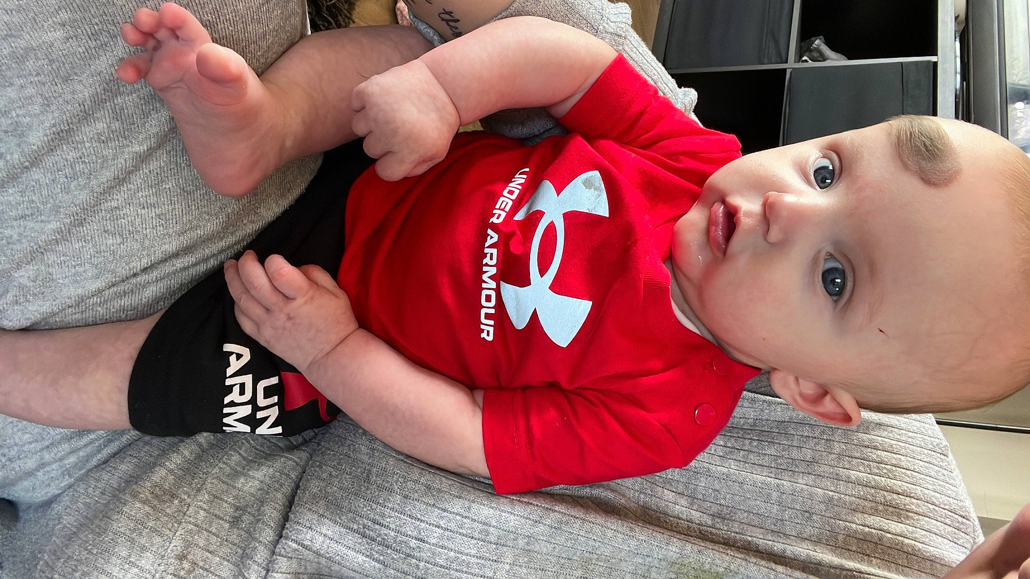 Albie joined the competition — help win amazing prizes! arm, baby, baby_toddler_clothing, carmine, clothing, elbow, eyelash, fun, gesture, hand, human_leg, joint, knee, person, sitting, sleeve, t_shirt, thigh, thumb, toddler
