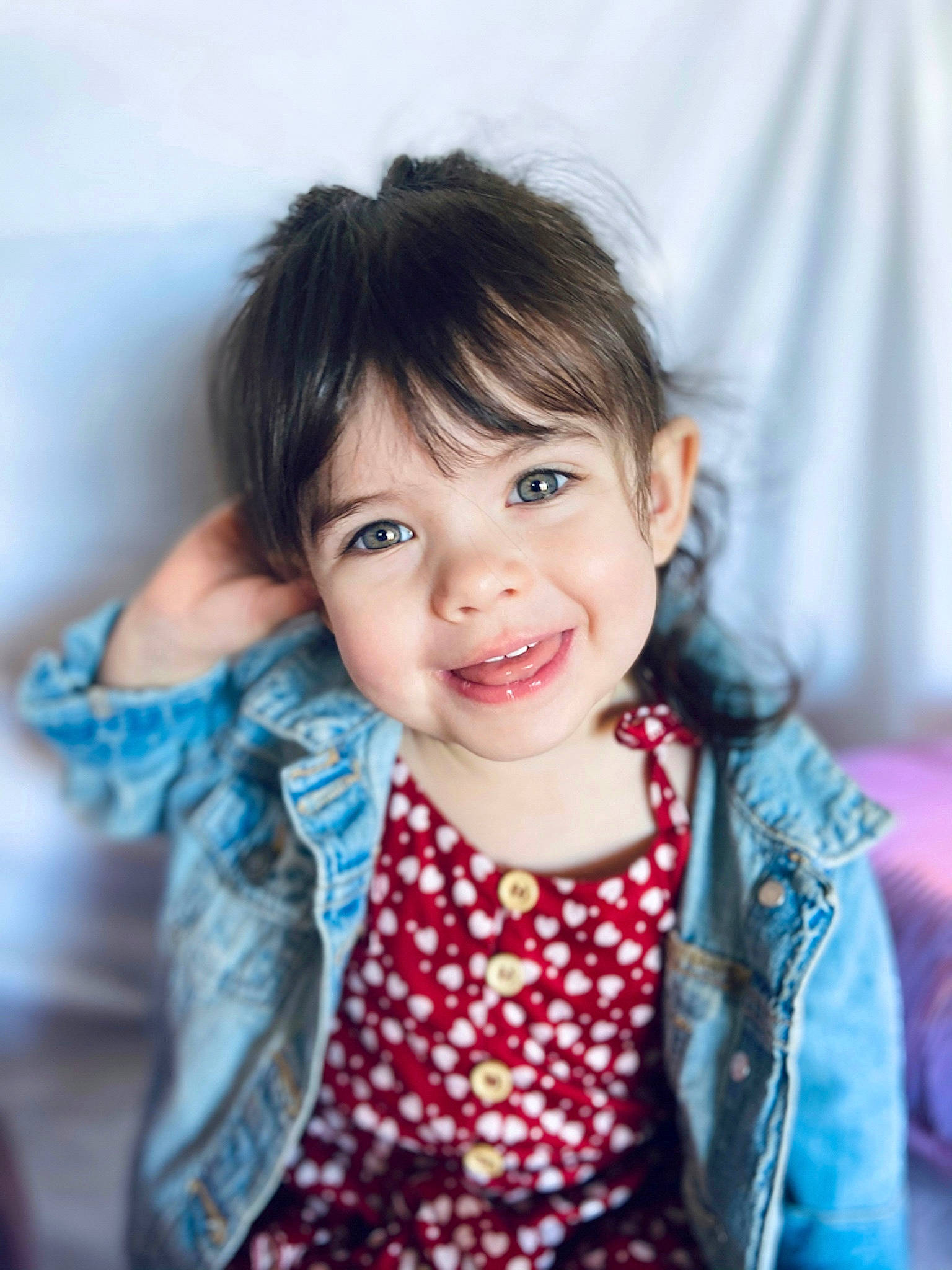 Quinn is registered to the contest to win money with this photo: baby_toddler_clothing, black_hair, cheek, eyebrow, eyelash, flash_photography, gesture, hand, happy, iris, joy, lip, neck, nose, outerwear, person, shoulder, skin, sleeve, smile