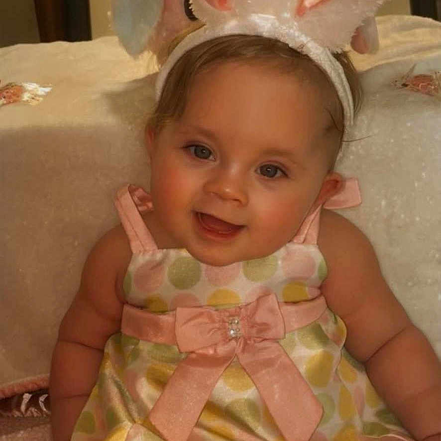 Rosavina is registered to the contest to win money with this photo: accessories, animal, baby, bonnet, clothing, costume, dress, face, fish, formalwear, furniture, hat, head, indoors, person, photography, portrait, sealife, shark, sitting