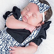 Jaliyah joined the competition — help win amazing prizes! baby, sleeping, infant, headband, bow, black_clothing, white_background, soft_texture, peaceful, cute, portrait, child, closeup, newborn, hand, face, resting, adorable, fashion, soft_lighting