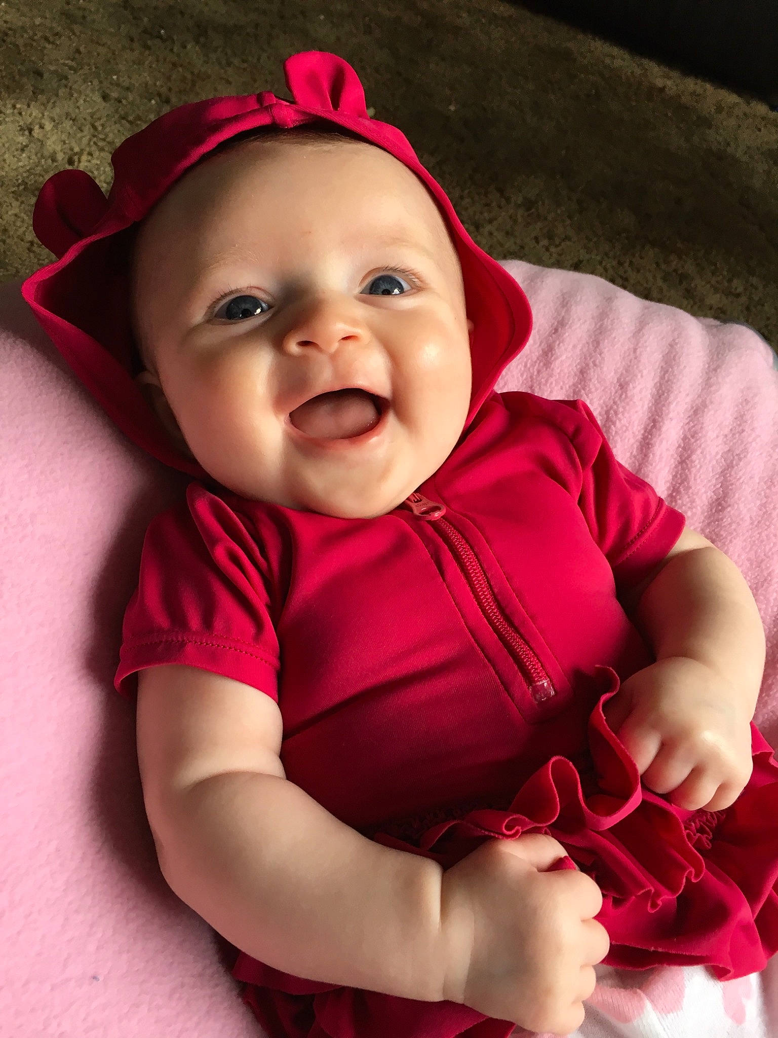 Rosalee is registered to the contest to win money with this photo: baby, baby_products, baby_toddler_clothing, cheek, child, face, facial_expression, happy, head, headgear, lip, magenta, mouth, person, pink, product, red, sitting, skin, smile