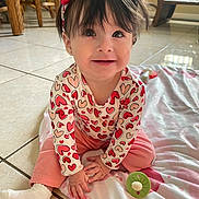Leah joined the competition — help win amazing prizes! baby, toddler, child, smiling, sitting, headband, heart_pattern, pink_pants, onesie, blanket, toy, tile_floor, earrings, dark_hair, big_eyes, indoors, natural_light, portrait, cute, playtime